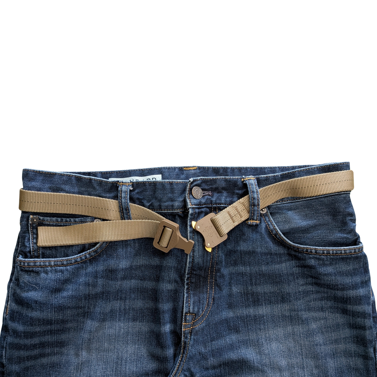 TAN499 Belt with black center thread. Cobra Prostyle buckle. Shown on blue jeans. Unclipped. 